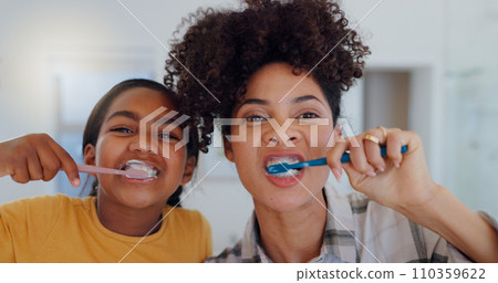 Portrait, bathroom and mother brushing teeth with child for oral health and wellness at home. Bonding, hygiene and young mom and girl kid with morning dental care routine together at house in Mexico. 110359622