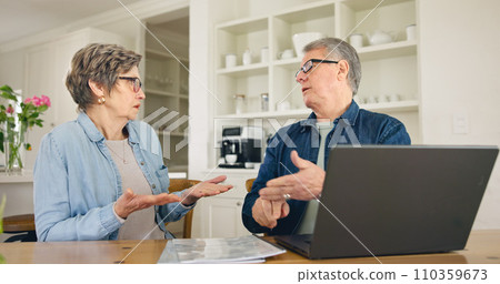 Laptop, budget and stress with a senior couple in their home together, talking about accounting or finance. Tax, debt or financial crisis with an elderly man and woman in disagreement about money Laptop, budget and stress with a senior couple in their home together, talking about accounting or finance. Tax, debt or financial crisis with an elderly man and woman in disagreement about money 110359673