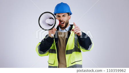 Angry man, architect and pointing with megaphone for construction or protest against a gray studio background. Portrait of male person, contractor or engineer shouting or screaming on loudspeaker Angry man, architect and pointing with megaphone for construction or protest against a gray studio background. Portrait of male person, contractor or engineer shouting or screaming on loudspeaker 110359962