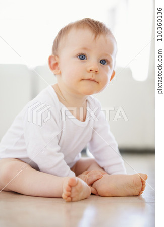 Home, playing and young baby on floor to relax, resting and calm in nursery learning to crawl in morning. Family, youth and infant newborn in bedroom for child development, growth and wellness 110360136