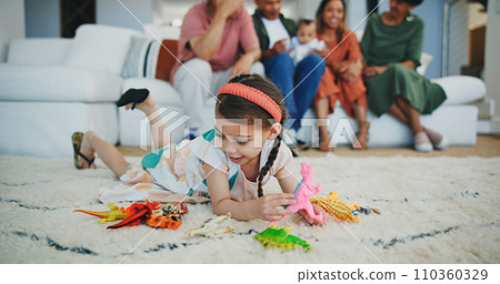 Girl kid, dinosaur toys and floor with playing, development and relax with game in room at family house. Child, plastic reptile and carpet with hands, flooring or animal for fantasy, learning or home 110360329