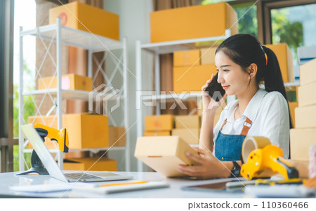 Small business owners online retailers are chatting, selling products and checking orders for products that customers order - concept shopping online Small business owners online retailers are chatting, selling products and checking orders for products that customers order - concept shopping online 110360466