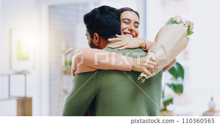 Man, woman and hug with bouquet of flowers for smile, care or love on birthday, anniversary or celebration. Couple, roses and happy for present, gift or surprise for bonding, romance or home together 110360565