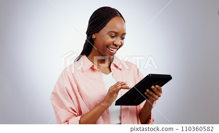 Woman, student and tablet for online research, typing information or e learning registration in studio. Happy african person on digital technology for college or reading website on a white background Woman, student and tablet for online research, typing information or e learning registration in studio. Happy african person on digital technology for college or reading website on a white background 110360582