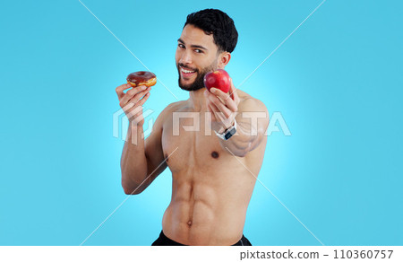 Happy man, portrait and apple with donut for diet, health or nutrition against a blue studio background. Male person or athlete showing natural organic red fruit with chocolate desert on mockup space Happy man, portrait and apple with donut for diet, health or nutrition against a blue studio background. Male person or athlete showing natural organic red fruit with chocolate desert on mockup space 110360757