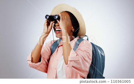Woman, binoculars and search on adventure, studio and travel or backpack by gray background. Black person, vacation and holiday in mockup, watch and explore on journey, gear and equipment for tourist Woman, binoculars and search on adventure, studio and travel or backpack by gray background. Black person, vacation and holiday in mockup, watch and explore on journey, gear and equipment for tourist 110361005