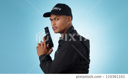 Man, security guard and holding gun for shooting, protection and hands with face, portrait or confident. Safety, service or weapon for criminal, law or studio background for pistol, crime or eyes 110361101