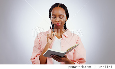 Woman, notebook and thinking of ideas, learning and studying with solution or goals on a white background. African student problem solving, reading notes and why face, confused or planning in studio Woman, notebook and thinking of ideas, learning and studying with solution or goals on a white background. African student problem solving, reading notes and why face, confused or planning in studio 110361161