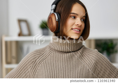 home woman music happy student earphones caucasian young indoor apartment headphones home woman music happy student earphones caucasian young indoor apartment headphones 110361340