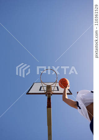 Man, basketball and low angle shot for point as jump athlete, game challenge or sky mockup. Male person, hand and string dunk score at hoop for exercise fun or fitness training sport, player on court Man, basketball and low angle shot for point as jump athlete, game challenge or sky mockup. Male person, hand and string dunk score at hoop for exercise fun or fitness training sport, player on court 110361529