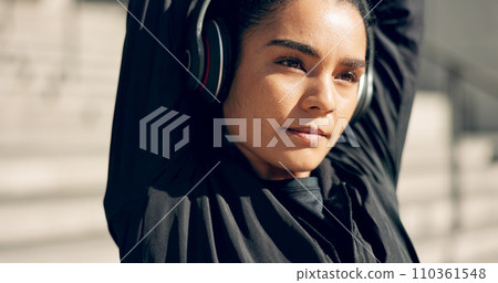 Fitness, headphones and woman stretching in city, workout and exercise for body health. Music, athlete and serious person warm up arms in urban town, listen to radio sound on technology and thinking Fitness, headphones and woman stretching in city, workout and exercise for body health. Music, athlete and serious person warm up arms in urban town, listen to radio sound on technology and thinking 110361548