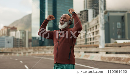 Exercise, celebration and senior man, headphones, city and achievement with workout, streaming music and radio. African person, pensioner and runner with headset, progress and fitness wellness or joy 110361660
