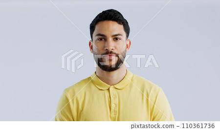 Man, fashion and confidence in studio portrait for trendy style, beard and clothes by white background. Student guy, latino person and model with yellow golf tshirt for with cool aesthetic in Mexico 110361736