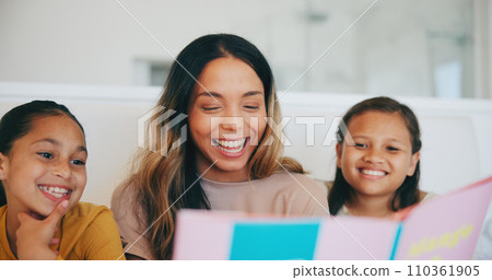 Happy, book and children reading with mom in living room and relaxing together at home. Smile, bonding and girl kids enjoying a story or fantasy novel with young mother in the lounge of modern house. 110361905