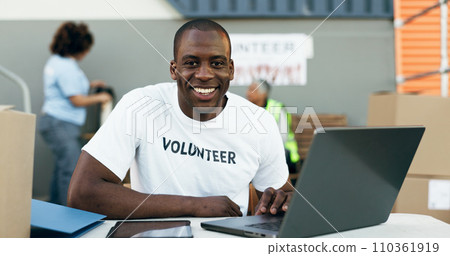 Volunteer man, laptop and portrait for donation, clothes drive and smile for community service, scroll and web. African person, pc and social responsibility with boxes, charity and ideas for helping Volunteer man, laptop and portrait for donation, clothes drive and smile for community service, scroll and web. African person, pc and social responsibility with boxes, charity and ideas for helping 110361919