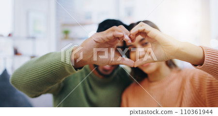 Heart, hands and couple in home with love, care and support of trust, gratitude and romantic icon. Closeup of man, woman and emoji sign for peace, hope and loyalty of kindness, respect or anniversary 110361944