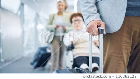 Hand, luggage and a business person in an airport for travel, waiting in line for boarding a flight closeup. Gate, terminal and a corporate employee with a suitcase for bag on a trip or journey 110362122