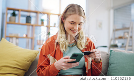 Woman, credit card and phone for online shopping in home with digital payment, fintech and finance of money. Happy person on sofa for mobile banking, ecommerce and password for sales on financial app Woman, credit card and phone for online shopping in home with digital payment, fintech and finance of money. Happy person on sofa for mobile banking, ecommerce and password for sales on financial app 110362126