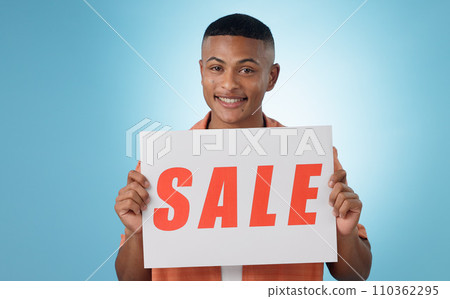 Portrait, sale sign or happy man by offer, discount deal or launch for poster or business advertising. Show, smile or person with board for message, marketing or promotion card on blue background 110362295