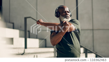 Fitness, headphones and senior black man stretching in city, workout and exercise for body health. Music, serious athlete and warm up on steps or stairs in urban town, listening to audio and thinking 110362463