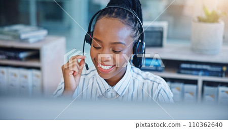 Black woman, call center and consulting on headphones in customer service, support or telemarketing at office. African female person, consultant or agent talking in online advice or help at workplace 110362640
