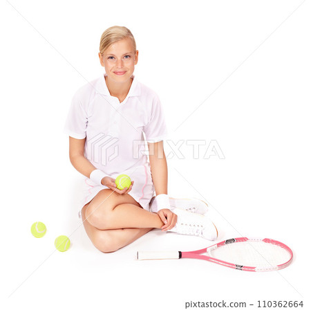 Portrait, woman and sitting with tennis balls, racket and skill for sports, competition and break in studio on white background. Happy professional athlete on floor with bat for performance for match Portrait, woman and sitting with tennis balls, racket and skill for sports, competition and break in studio on white background. Happy professional athlete on floor with bat for performance for match 110362664