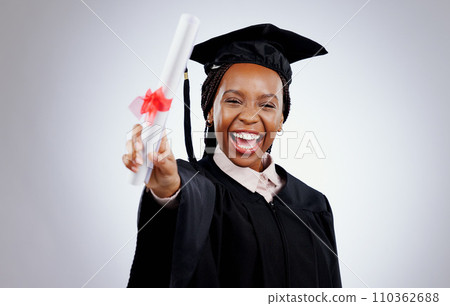 Graduate, woman and student diploma for education, college or university success on a white background. Excited portrait of person with graduation award, certificate or learning achievement in studio 110362688