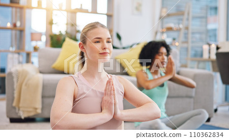 Yoga, meditation and women in home together, fitness and mindfulness training in living room. Balance, breathing and workout, friends in holistic exercise in peace and zen for health in apartment. 110362834