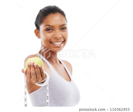 Happy, woman and lose weight with apple and tape measure in white background, studio or mockup. Model, portrait and healthy food for results in fitness, wellness or diet with fruit or nutrition Happy, woman and lose weight with apple and tape measure in white background, studio or mockup. Model, portrait and healthy food for results in fitness, wellness or diet with fruit or nutrition 110362955