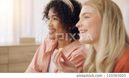 Face, home and relax friends watching tv series, movies and streaming video, news broadcast or show. Lounge, eating popcorn food and gen z people watch television, film and change channel with remote 110363003