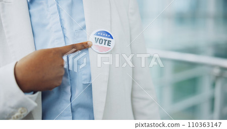 Hand, sticker and vote for president election or cast ballot, poll station for government selection. Black person, finger pointing and badge for politics decision support, patriotic or usa opinion 110363147