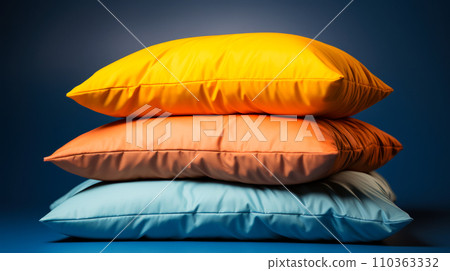 Close-up on large multi-colored pillows on a dark blue background, world sleep day concept, advertising of pillows and sleep accessories Close-up on large multi-colored pillows on a dark blue background, world sleep day concept, advertising of pillows and sleep accessories 110363332