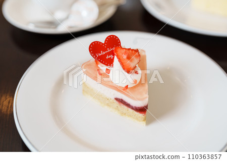 Homemade Cheese Cake with fresh strawberries and hot Tea cup. Dessert and beverage for Happy Valentine Day celebration Homemade Cheese Cake with fresh strawberries and hot Tea cup. Dessert and beverage for Happy Valentine Day celebration 110363857