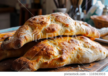 Puri traditional Georgian bread on an old wooden table in a bakery, Puri is most recognizable pastry in Georgia due to its shape, the freshest fragrant bread from a bakery near home, small business 110363933