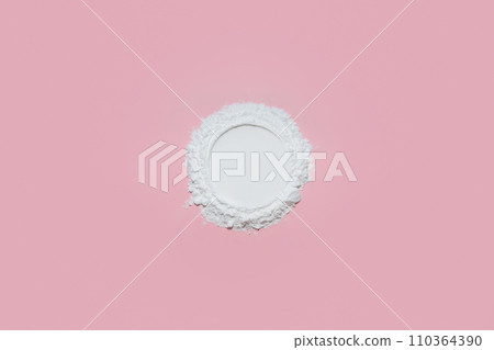 Clear white face powder with an empty circle on a soft pastel pink background, designed as a product placement backdrop for feminine beauty items. Clear white face powder with an empty circle on a soft pastel pink background, designed as a product placement backdrop for feminine beauty items. 110364390