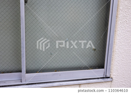 Wired glass damaged by impact Wired glass damaged by impact 110364610