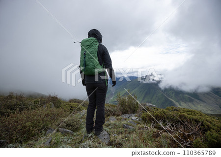 Hiking woman on high altitude mountain top 110365789