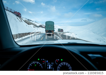 Driving car on the snowy mountain road, China Driving car on the snowy mountain road, China 110365815