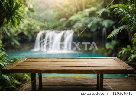 Empty wooden table top with blur jungle background with bokeh light. 110366715