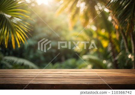 Empty wooden table top with blur jungle background with bokeh light. Empty wooden table top with blur jungle background with bokeh light. 110366742