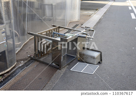 Commercial stainless steel sink protruding from transparent vinyl curtain with flame retardant thread 110367617