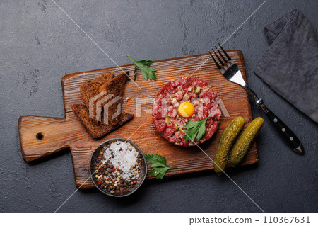 Savory beef tartare and brown bread toasts Savory beef tartare and brown bread toasts 110367631
