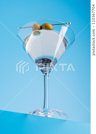 Classic martini against a cool blue background Classic martini against a cool blue background 110367704