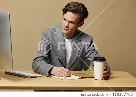 Young Businessman Working at Office Desk Young Businessman Working at Office Desk 110367706