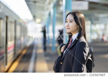 High school girl waiting for the train on the station platform 110367807