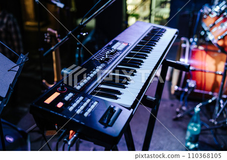 synthesizer close-up. concert in a bar. live music. electronic musical instrument. 110368105
