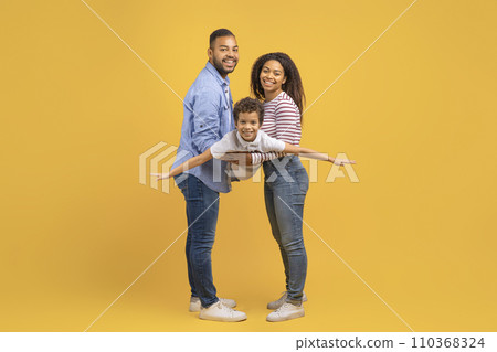 Family Fun. Cheerful Black Mom And Dad Playing With Their Preteen Son 110368324