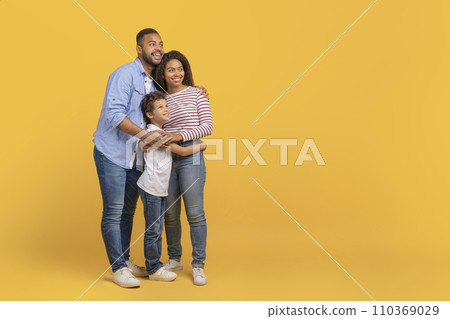 Happy African American Parents And Son Embracing And Looking At Copy Space 110369029