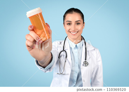 Woman doctor offering medication bottle, healthcare theme Woman doctor offering medication bottle, healthcare theme 110369320