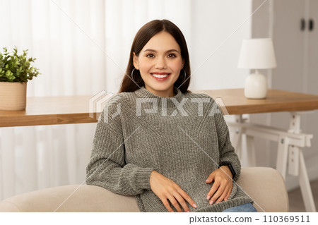 Beautiful brunette lady expressing joy and happiness, home interior 110369511